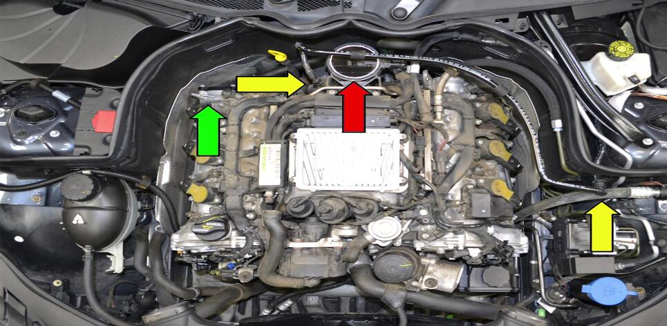 There is a breather hose on the top rear of the right valve cover. This hose can fail over time as well as the cover can begin to leak. If your cover is leaking or the hose has failed and is causing a vacuum leak this article will show you how to replace them.   Preparations: Parts Required: Cover or hose  Hot Tip: Use a mirror to see the oil built up  Performance Gain: Smoother running car  Complementary Modification: Replace air filters  Applicable Models:  Mercedes-Benz C350 (2008-14)  Mercedes-Benz GLK350 (2010-14)  Procedures: You need to remove the engine covers and air intake ducts to perform this work.Pleae read the engine cover removal: How to Remove Benz C Class W204 Engine Cover  The breather hose from the right side valve cover (green arrow) attaches to the elbow bellow the MAF sensor.It is much easier to replace the hose out of the engie compartment so you next need to remove the MAF (read arrow) and vacuum line (yellow arrow).Please read the article on MAF sensor replacement for additional information. 1 Disconnect the breather hose from the rear of the right cylinder head (red arrow) 2 Unclip the two plastic clips on the elbow piece between the MAF and throttle body (red arrow) and remove the elbow and attached hose.With the elbow removed you can easily replace the hose. 3 With the hose disconnected you need to remove the four E10 Torx bolts from the cover (red arrow).There is very little room to work on so take your time and make sure you don’t drop any hardware while removing it. 4 With the four bolts removed you can wiggle the cover off the rear of the valve cover and replace it (red arrow). 5 The gasket or seal (red arrow) is ususlly where the cover leaks.Unfortunately at the time of writing this article there was not a separate replacement gasket available.You will need to replace the whole cover.Check before ordering for an update on the status of just the gasket.Installation is reserve of removal. 6 Done!